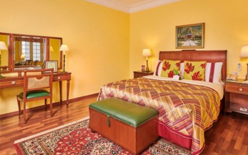 Bedroom interior at The LaLiT Grand Palace Srinagar